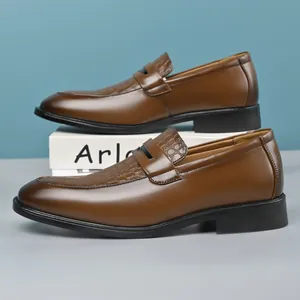 Classic brown leather loafers for men featuring elegant crocodile texture detail