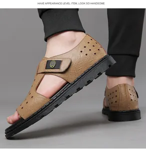 Close-up of tan men's hollow leather sandals with breathable design and black sole