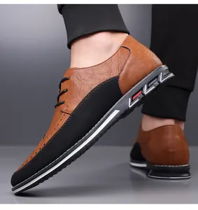 Vista laterale di scarpe casual da uomo in pelle marrone e nera con dettagli stile brogue