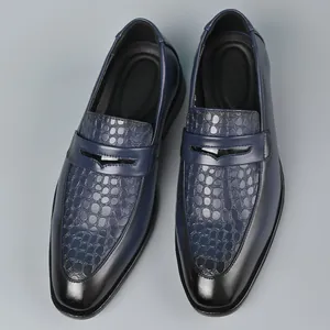 Top view of men's navy blue leather loafers with embossed crocodile texture pattern