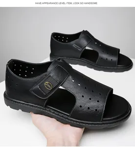 Detail view of men's black hollow-out leather sandals in Roman open-toe style