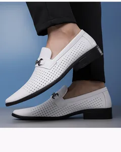 Detail view of white perforated men's loafers with metal buckle and breathable design.