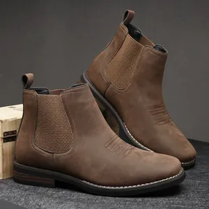 Side view of men's brown Chelsea faux leather boots with elastic panels and stitching detail