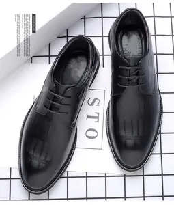 Detailed top view of black crocodile patterned leather men's formal business dress shoes