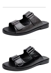Detailansicht klassischer Herren-Sandalen aus Leder in Schwarz und Braun gehalten