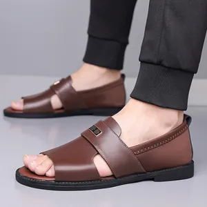 Close-up view of stylish brown leather men's summer sandals with non-slip black soles