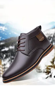 Detail view of men's brown leather winter boots with textured finish and laces.