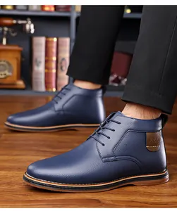 Detail of navy blue men's high-top leather casual business boots on wooden floor