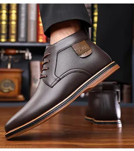 Close-up detail of dark brown pebble grain leather business casual men's ankle boots