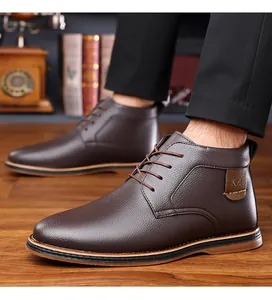 Detail shot of brown leather business casual boots for men with lace-up design