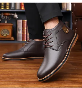 Close-up view of premium dark brown men's business casual leather boots with lace-up detail