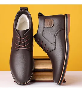 Detailed view of men's warm brown leather casual boots with soft white fleece lining
