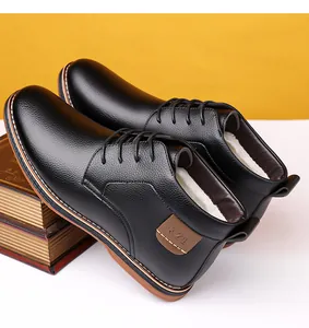 Side detail view of black business casual leather boots featuring warm white fleece lining