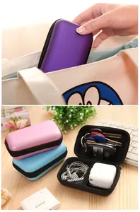 Detail view of multi-color portable EVA storage cases for earphones and electronics.