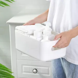 Cesta de almacenamiento minimalista blanca de plástico con asas para organizar el hogar