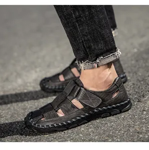 Close-up view of men's genuine leather sandals with closed-toe design and textured finish