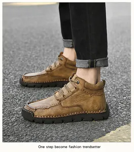 Détail de chaussures de randonnée montantes brunes pour hommes avec coutures artisanales