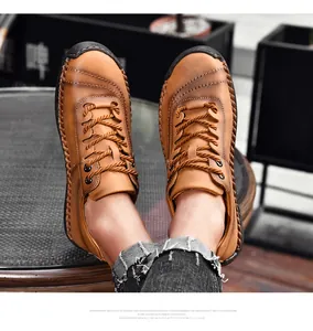 Close-up of handmade stitching on retro brown leather casual men's outdoor shoes.