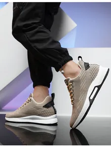 Detailed side view of men's breathable fly-knit sneakers featuring thick white soles