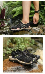 Detailed macro view of men's breathable leather outdoor sandals resting on wet rocks
