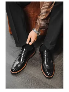 Top-down view of black leather dress shoes for men in a formal business setting