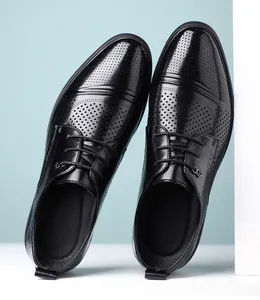 Detailed view of black perforated leather Derby shoes for men's business formal wear.