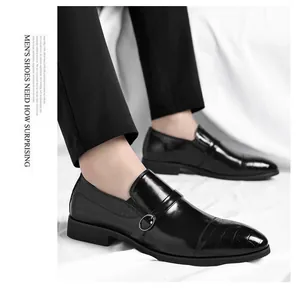 Close-up of men's black formal business shoes featuring a side buckle and embossed crocodile pattern