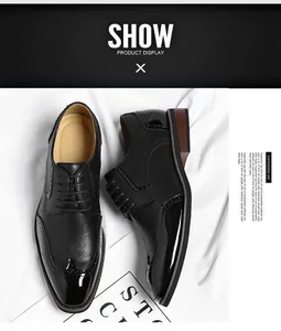 Close-up of men's black Brogue dress shoes with wingtip and patent leather toe details.