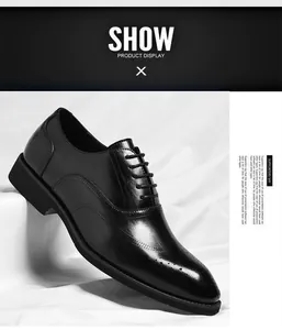 Detailed view of elegant black leather men's Oxford shoes featuring classic brogue patterns.