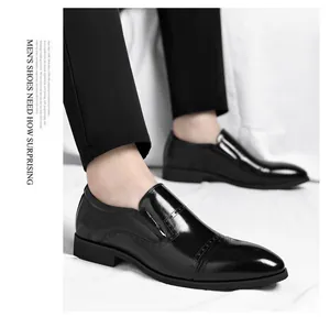 Detailed view of elegant black glossy pointed toe slip-on formal leather shoes for men.