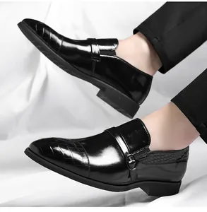 Detailed view of polished black leather Oxford shoes with crocodile texture and buckle.