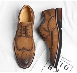 Detailed top-down view of men's brown suede wingtip brogue oxford dress shoes