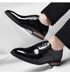 Close-up detail of classic black polished leather brogue Oxford dress shoes for men