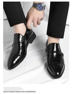 Close-up of men's black patent leather business shoes with crocodile skin texture