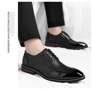 Detailed side view of premium men's black Brogue leather dress shoes with wingtip design