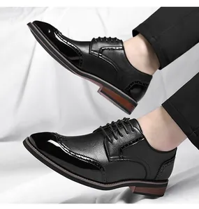 Detailed side view of men's black Brogue leather shoes with polished patent leather and textures