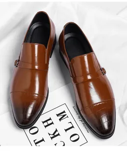 Top view of men's brown formal leather shoes with crocodile texture on toe cap