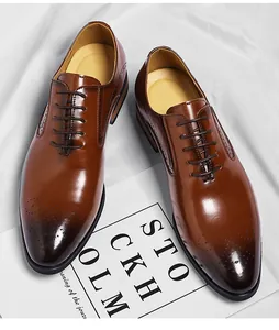 Close-up of brown leather Oxford shoes with brogue detailing and lace-up closure.