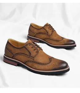 Close-up detail of brown suede brogue Oxford shoes with wingtip perforations