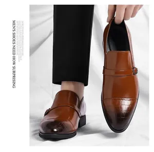 Brown men's business leather shoes featuring classic crocodile pattern on the toe cap