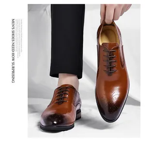 Detailed view of polished brown men's brogue oxfords with elegant perforation