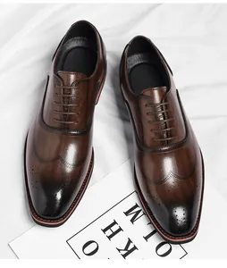 Detailed macro view of brown leather brogue oxfords with classic wingtip design