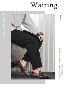 Classic brown leather loafers for men featuring a stylish metal buckle detail.