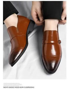 Close-up view of men's brown leather business shoes featuring a crocodile pattern toe design