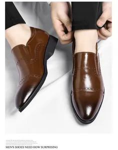 Detailed macro view of men's brown glossy formal leather shoes with classic brogue pattern