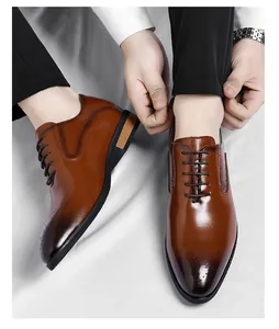 Detailed view of men's elegant brown leather Oxford dress shoes with brogue patterns