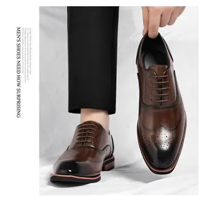 Detailed macro shot of classic brown leather wingtip brogue oxfords for men in business style