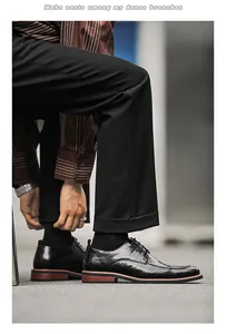 Detailed shot of black men's business leather shoes on a model in urban setting