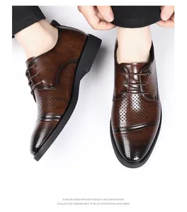 Macro detail of men's brown leather derby shoes with elegant brogue perforations