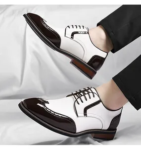 Detailed side view of white and brown men's Brogue leather shoes in British style
